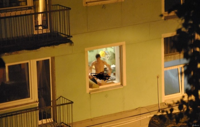 Naked woman on the windowsill