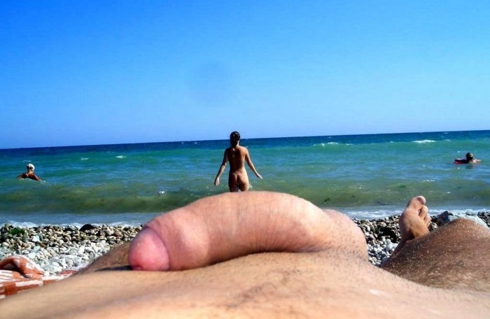 Naked men and women on the beach