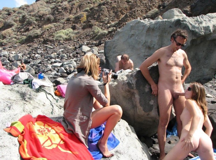 Naked nudists on an inflatable mattress