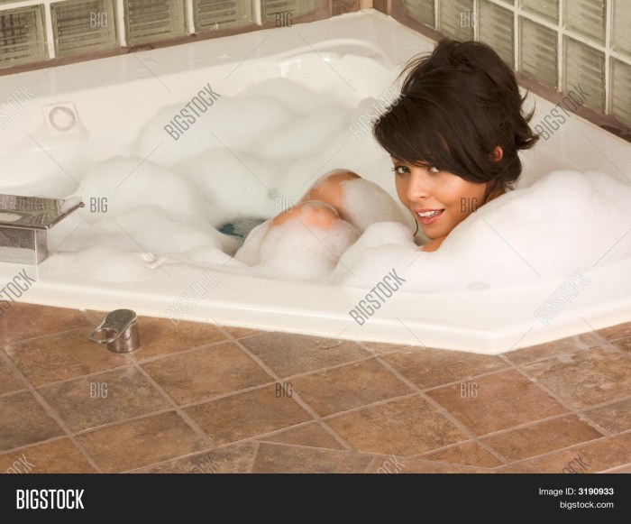 Woman in foam in a jacuzzi