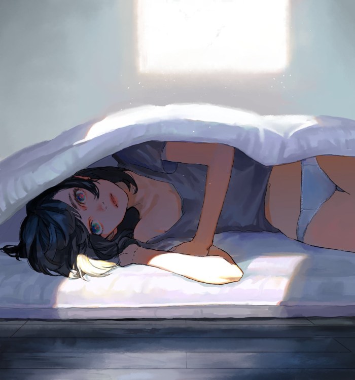 The girl lies on the bed