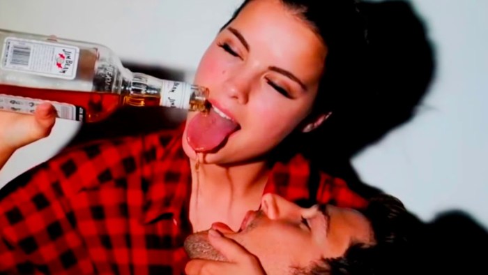 A guy with a girl drink whiskey