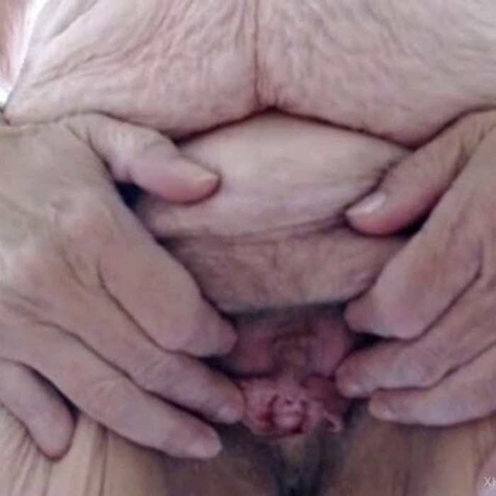 Woman with a large clitoris in shorts