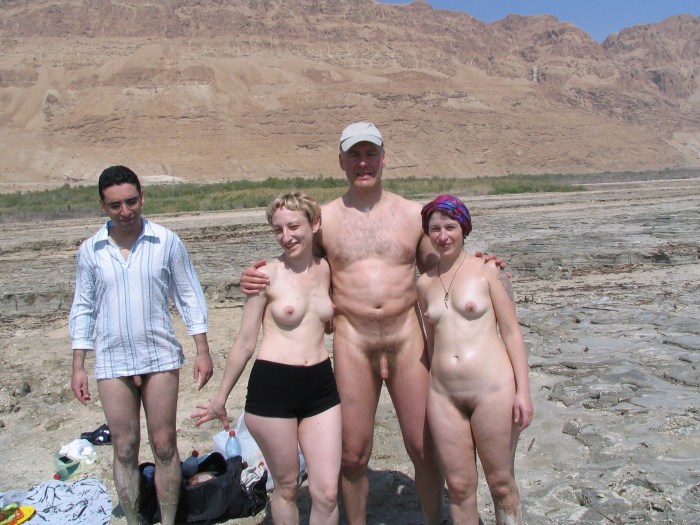 Naked girls bathed in mud