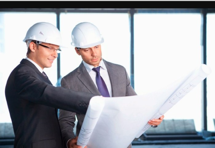 Engineers in helmets at the facility