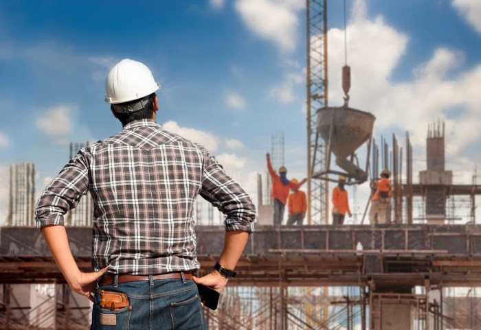 Builders on a construction site with their backs