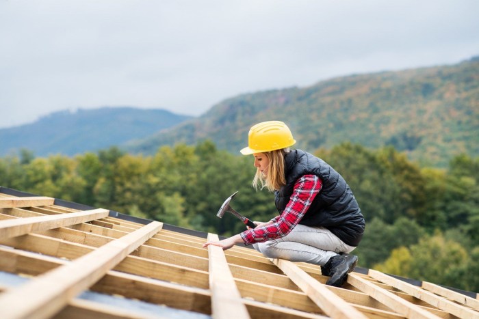 A woman is building a house