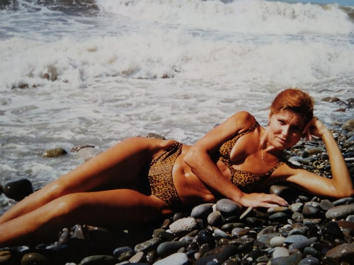 Big breasts of mature on the beach