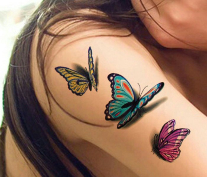 Butterfly tattoo under the chest