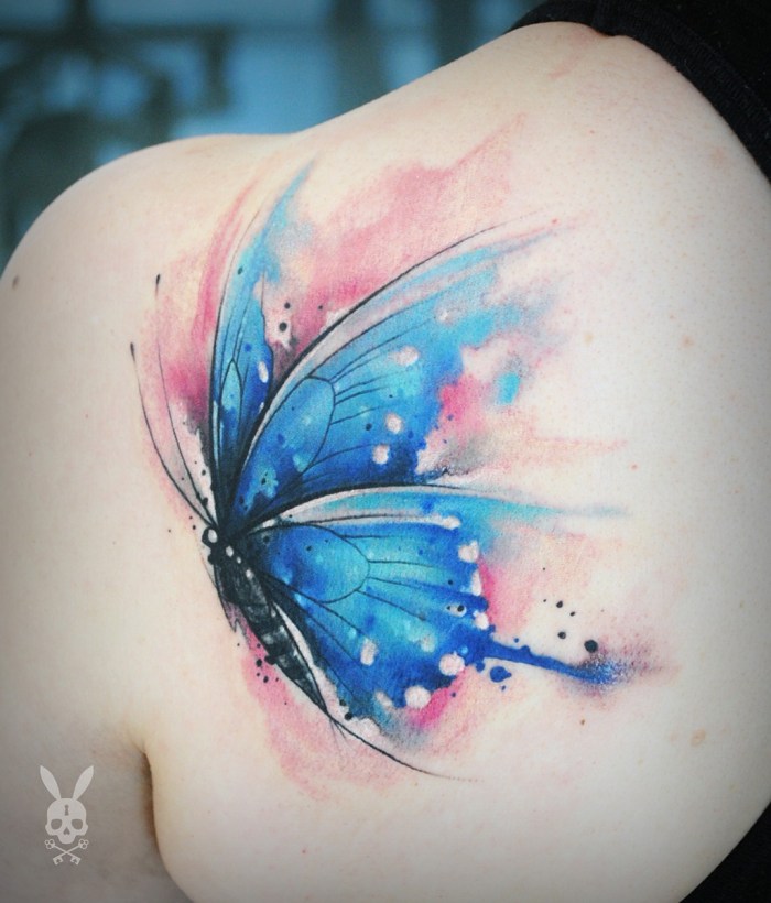 Tattoo butterfly on a collarbone