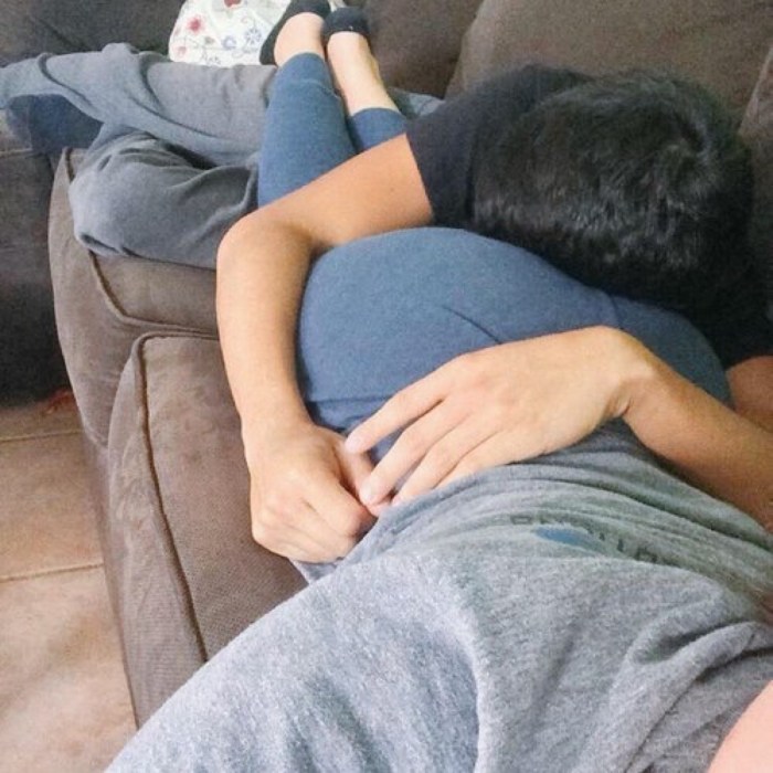 The guy hugs buttocks
