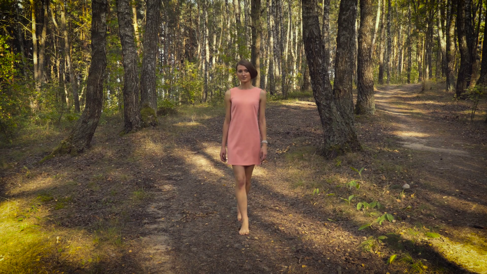 Girl is Walking in the Forest