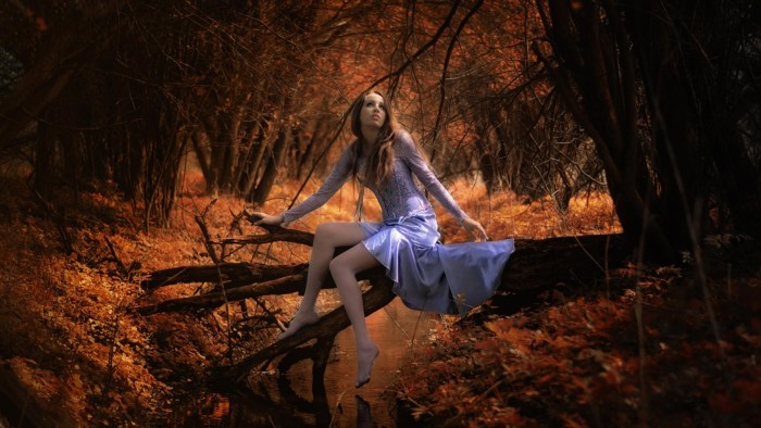Girl in the autumn forest