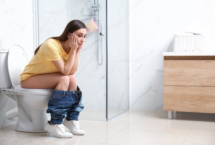 The girl licks the toilet