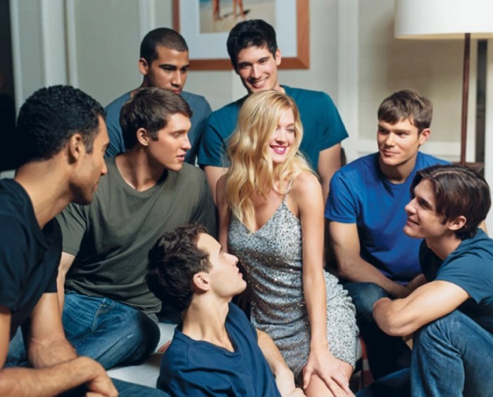 Woman surrounded by men