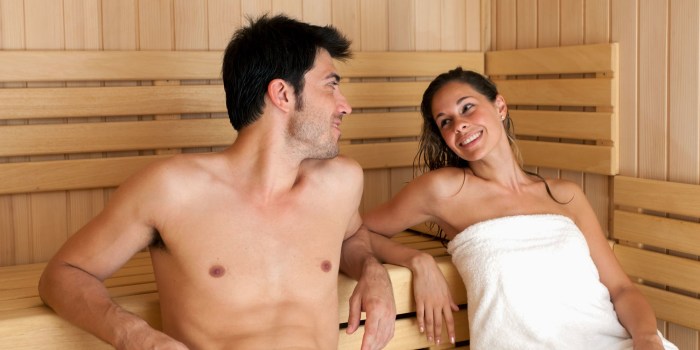 Naked women and men in the sauna