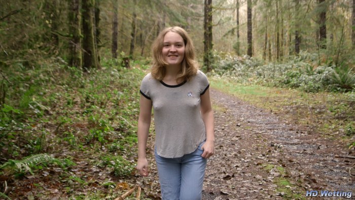 The girl pisses standing in the forest