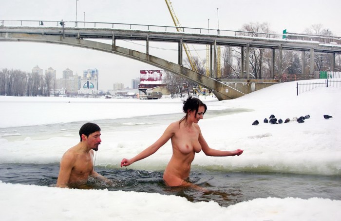 Naked women bathe in the hole