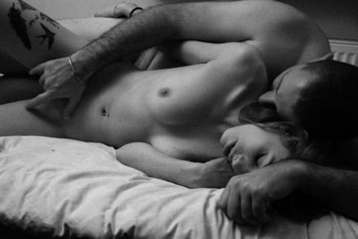 Man and woman naked in bed