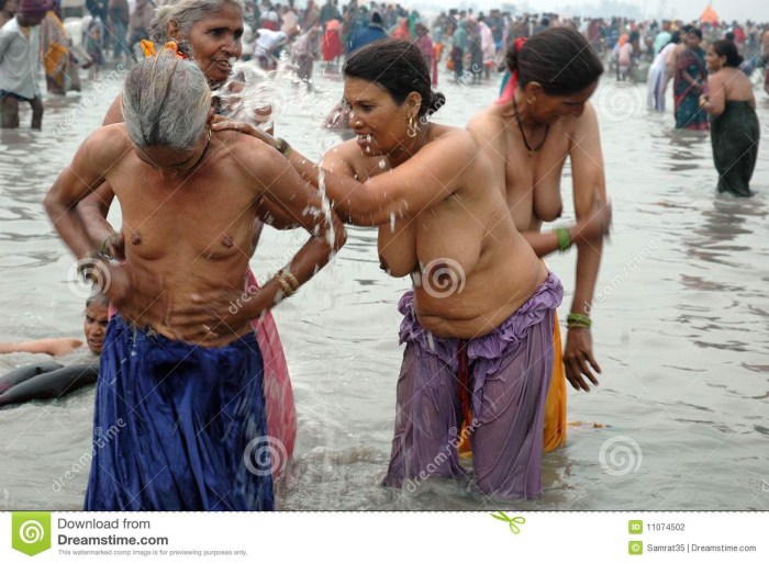 Naked women wash in the Gang River