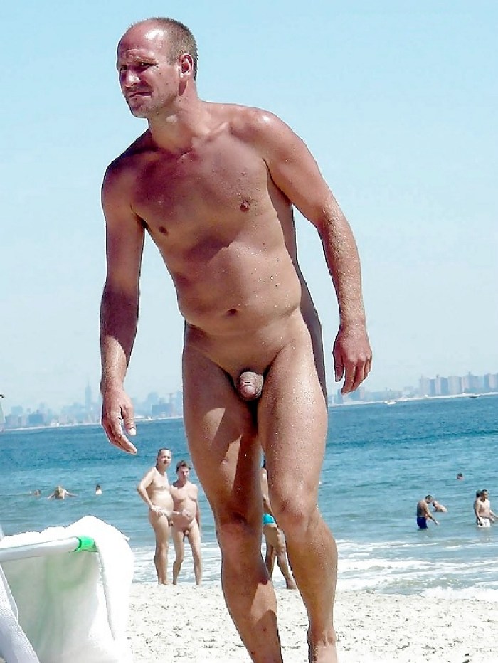 Naked guys without panties on the beach