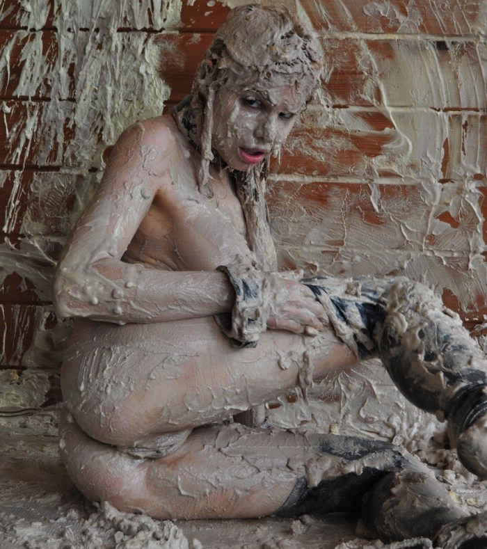 Women naked in the mud