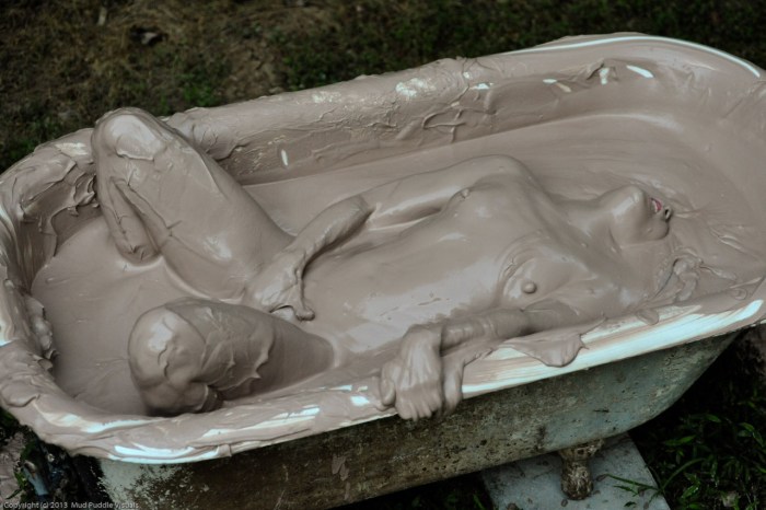 Naked women in a mud