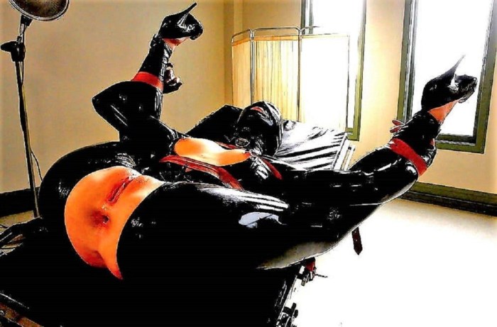 Girl in a latex suit bdsm