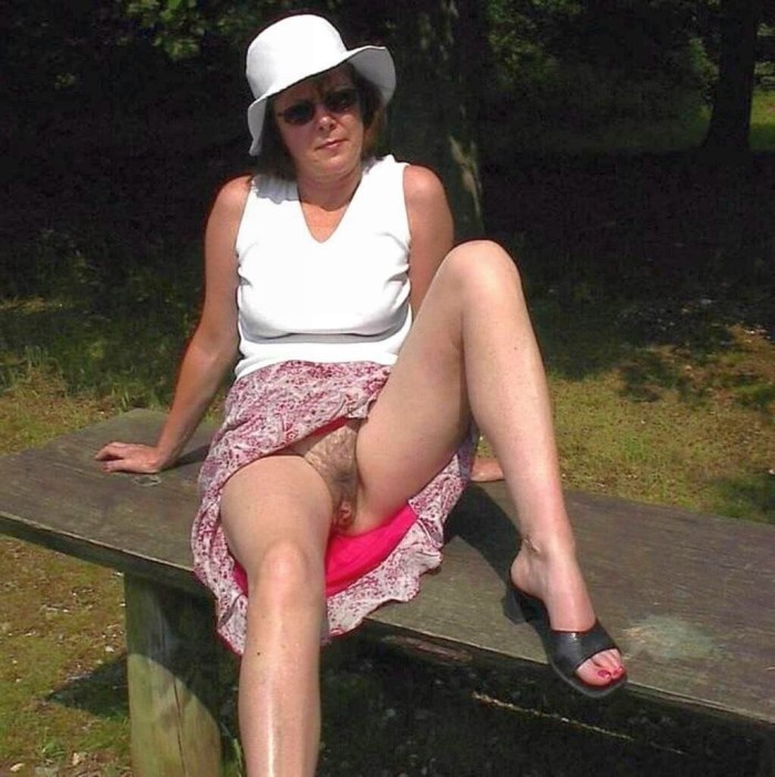 Adult women in a skirt without panties