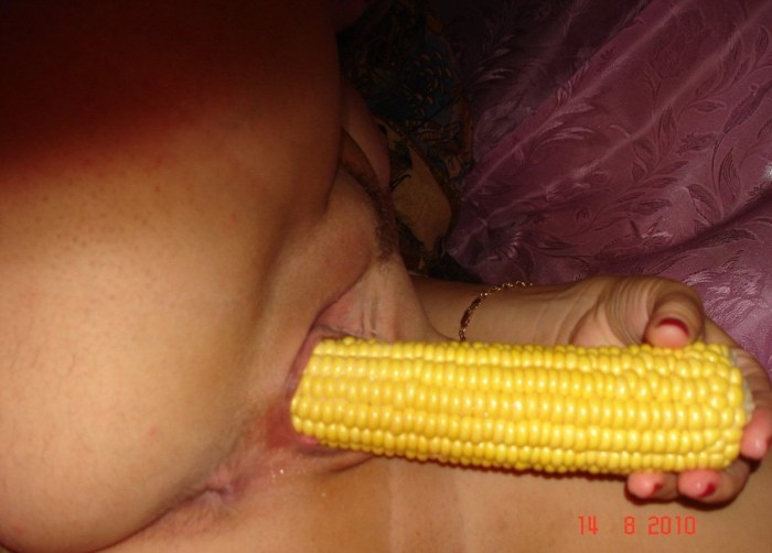 The wife masturbates with corn