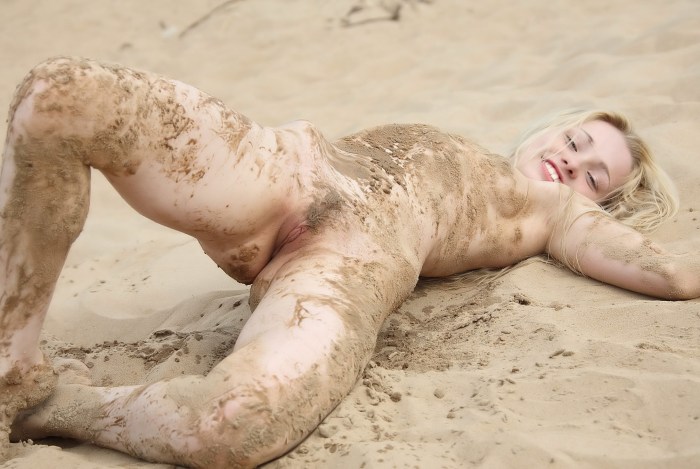 Naked girls bathed in mud