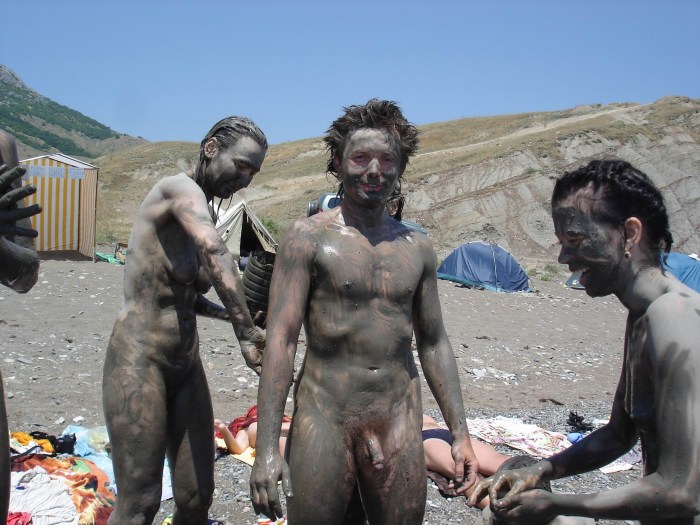 Naked in therapeutic mud